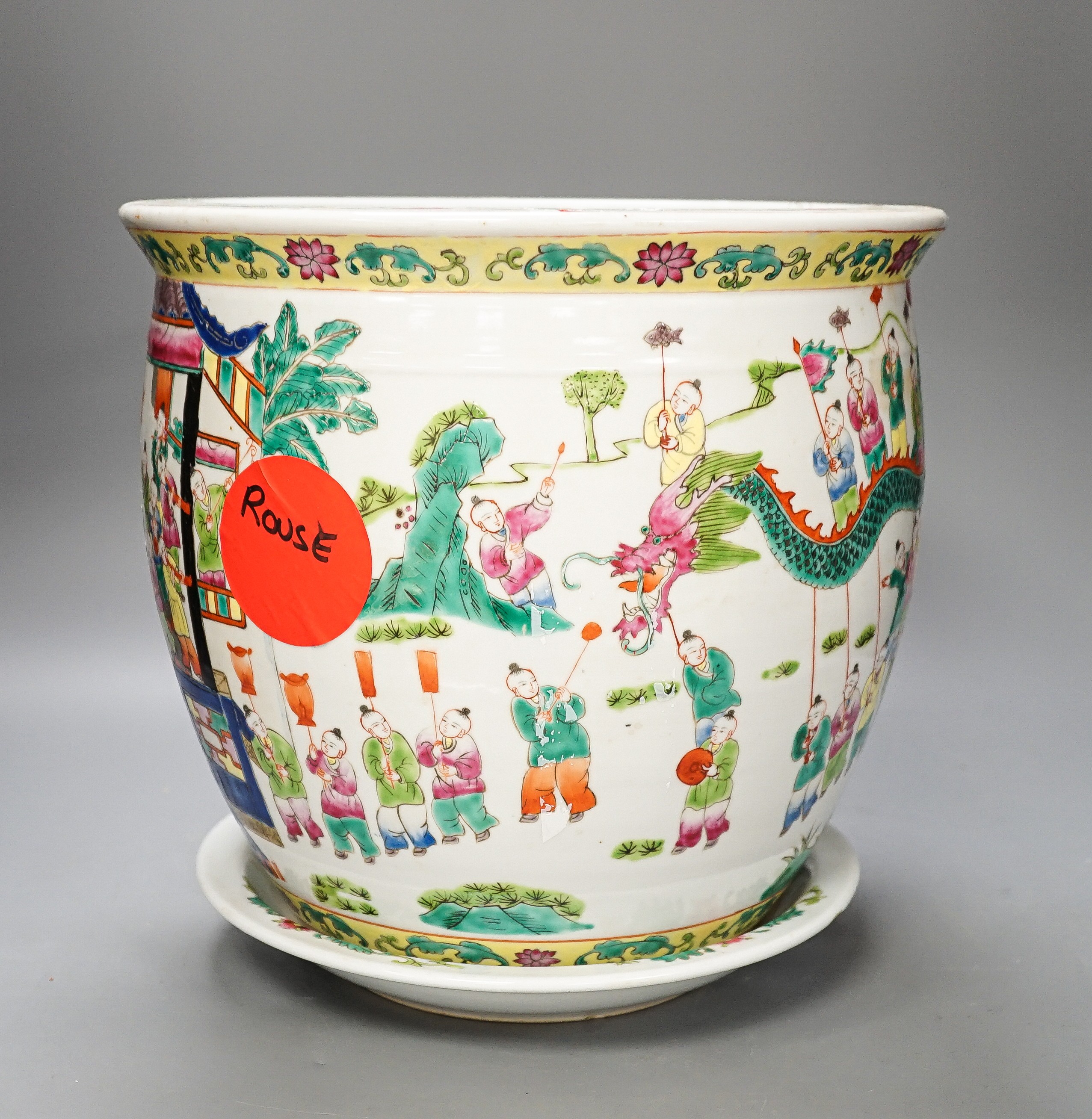 A 20th century Chinese famille rose jardiniere and stand total height 30cm